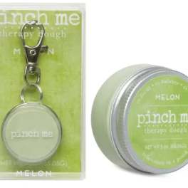 Melon-scented therapy dough tin and keychain in green packaging