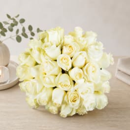Bouquet of white roses on a tabletop