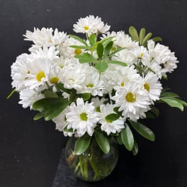 White daisy bouquet in a round glass vase