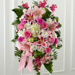Pink and white floral standing spray with lilies and roses