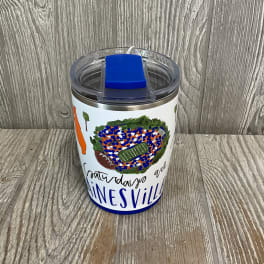 Insulated tumbler with a football-themed design and blue lid