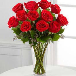 Bouquet of red roses in a clear glass vase