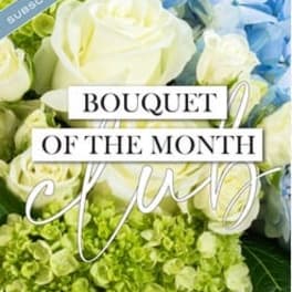 Bouquet of white roses, blue flowers, and green hydrangeas