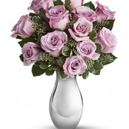 Lavender rose bouquet in a clear glass vase