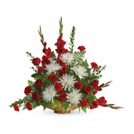 Red and white flower basket with roses, carnations, and large white mums in a fan-shaped design