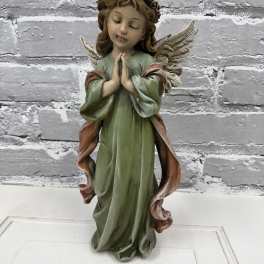 Decorative angel figurine with folded hands and wings
