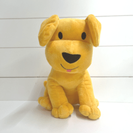 Yellow plush dog toy sitting upright