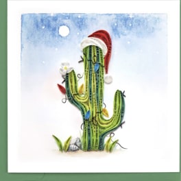 Quilled cactus artwork with a Santa hat on a snowy blue background