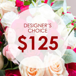 Mixed bouquet of white, pink, and peach roses with eucalyptus