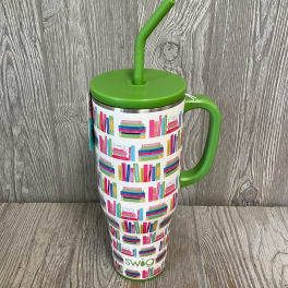 Green handled travel mug with a colorful bookshelf pattern and straw lid