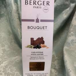 Maison Berger Paris Mystic Leather fragrance box on a green fabric background
