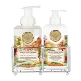 Two pump bottles of hand soap and lotion in a metal caddy