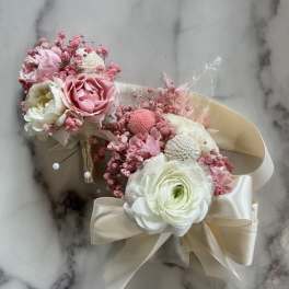 Pink and white floral bouquet with satin ribbon wrap