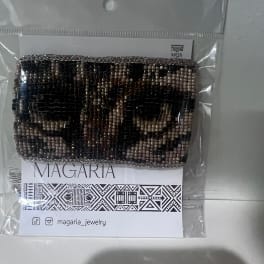 Beaded bracelet in a clear plastic package with a printed card
