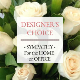 Cream roses with a sympathy message card