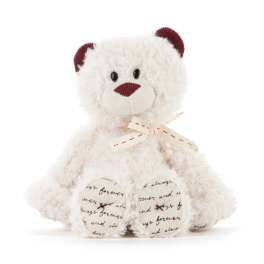 White teddy bear with burgundy ears and nose, tied with a ribbon