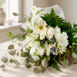 White bouquet with gerbera daisies, roses, and hydrangeas