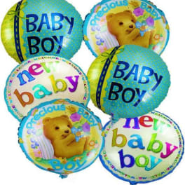 Cluster of baby boy and teddy bear balloons on a white background