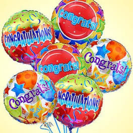 Cluster of colorful congratulatory balloons with star patterns