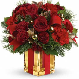 Red roses and carnations in a gold gift box with red ribbon