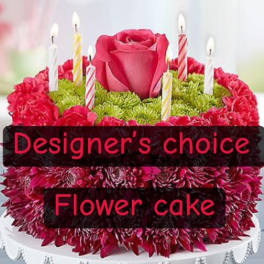 Flower cake with a pink rose and striped candle picks