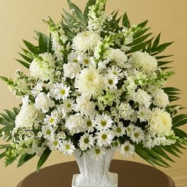 White floral arrangement in a textured white vase