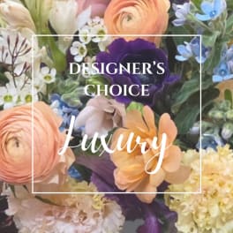 Mixed bouquet with peach, purple, blue, and white flowers