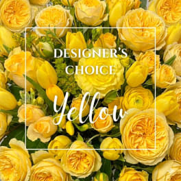 Yellow roses and tulips arranged in a dense bouquet