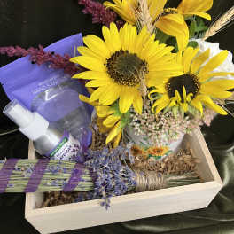 Sunflower arrangement in a wooden gift box with lavender items