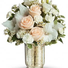 Peach and white rose bouquet in a gold vase