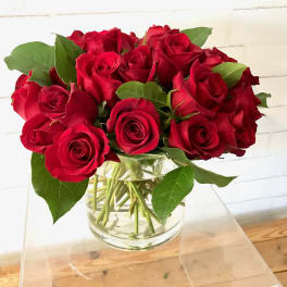 Bouquet of red roses in a clear glass vase