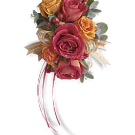 Hand-tied bouquet of pink and yellow roses with ribbon streamers