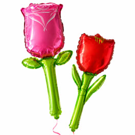 Two flower-shaped foil balloons, one pink and one red, with green stems
