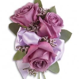 Small bouquet of lavender roses with satin ribbon and greenery