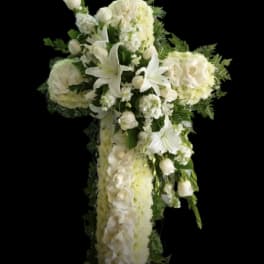 White floral cross arrangement with lilies and roses