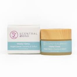 Two scented candle products in boxes on a white background