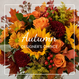 Autumn bouquet with sunflowers, orange roses, and burgundy mums