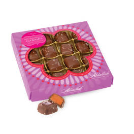 Box of milk chocolate sea salt caramels with one piece outside the box
