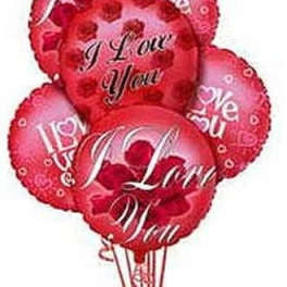 Cluster of red heart-shaped balloons with love messages