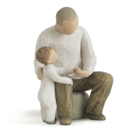 Wooden figurine of an adult and child sitting together