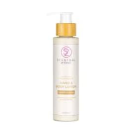 Bottle of Scentsy body lotion with a gold cap on a white background