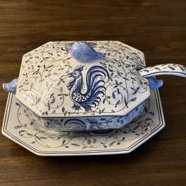 Blue-and-white ceramic covered serving dish on a matching platter