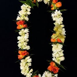 Orange roses and white flowers arranged in a floral garland