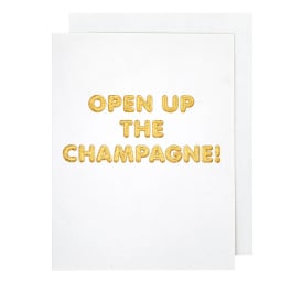 White card with gold text reading "OPEN UP THE CHAMPAGNE!"