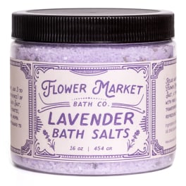 Jar of lavender bath salts with a black lid