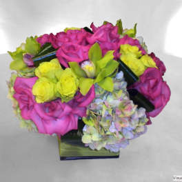 Pink and yellow rose bouquet with hydrangeas in a square vase