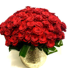 Red rose bouquet in a gold textured vase