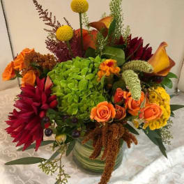 Colorful mixed flower arrangement in a glass vase