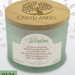 Green candle in a glass jar with a wooden lid