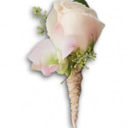 Small pale pink rose boutonniere with green accents